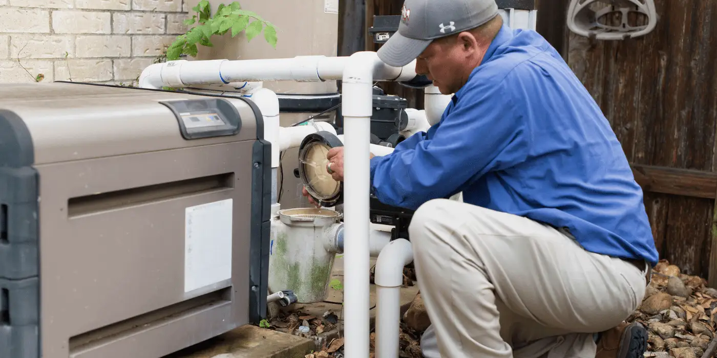 Technician performing pool repair in Boca Raton on a swimming pool pump